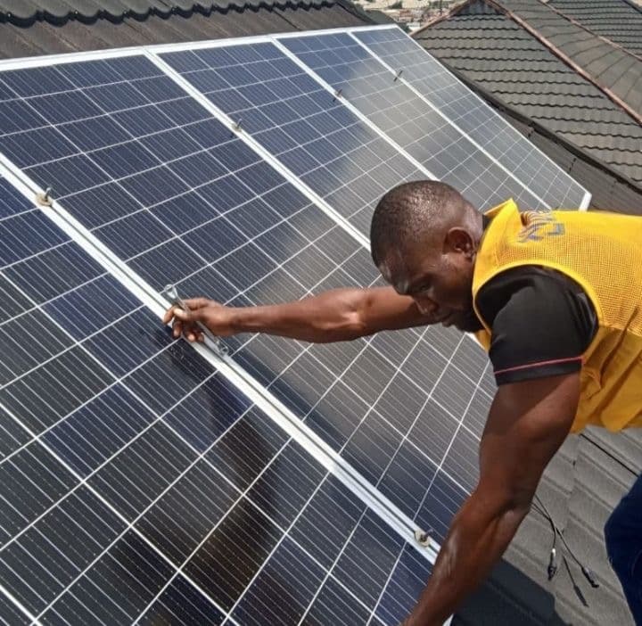 VoltEdge engineer installing solar panels on a residential rooftop